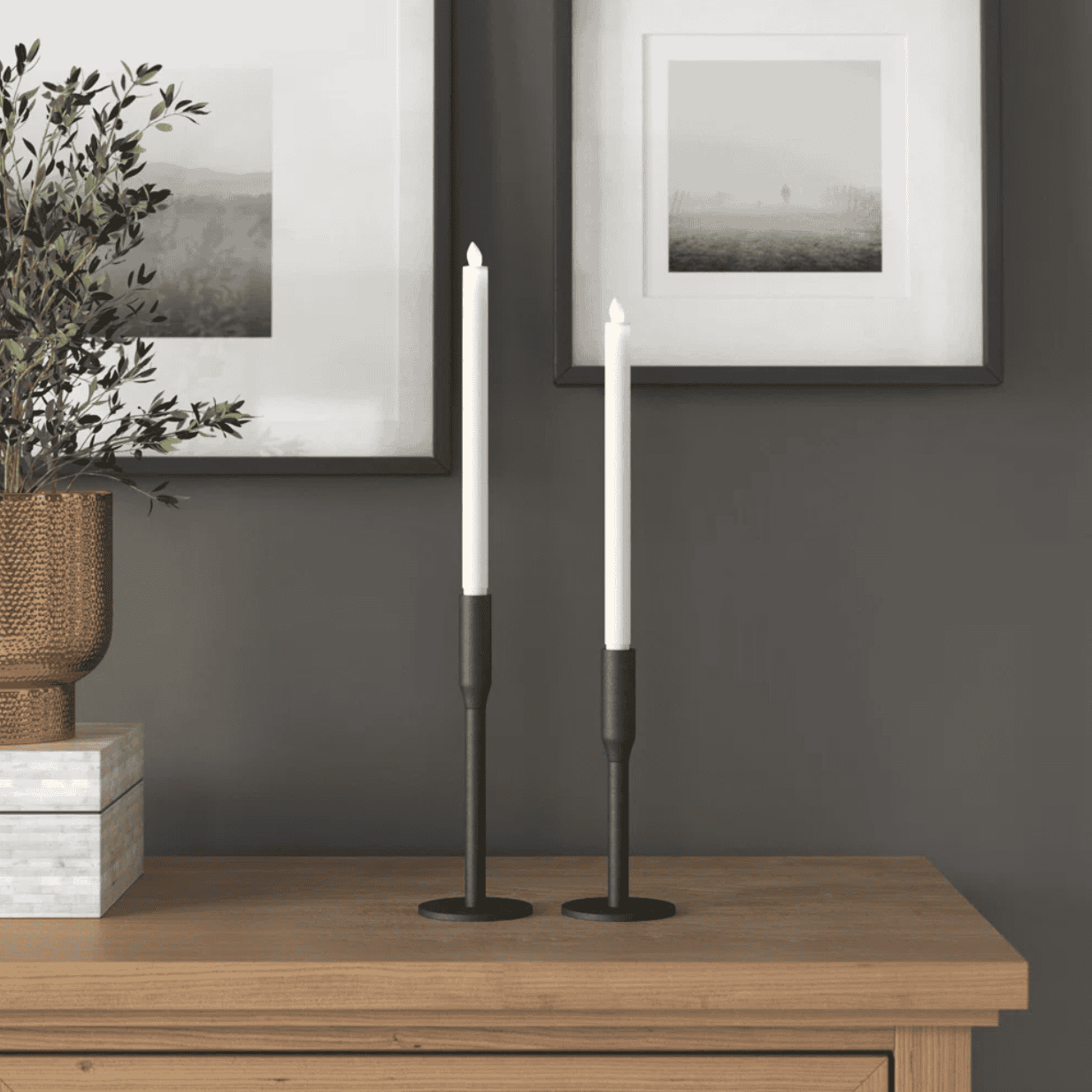 Lit candles in two black candlesticks.