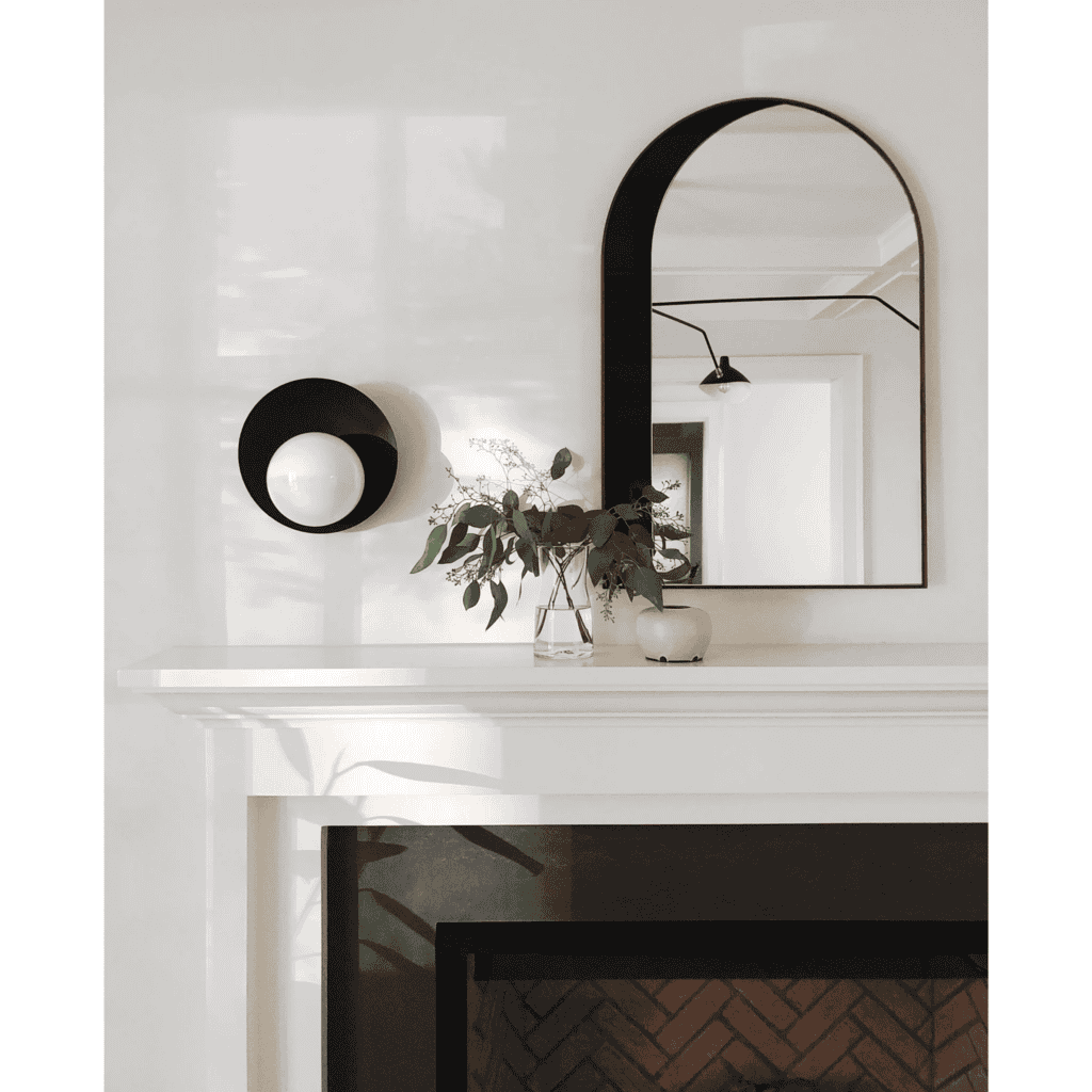Pearl flush mount over a mantle.