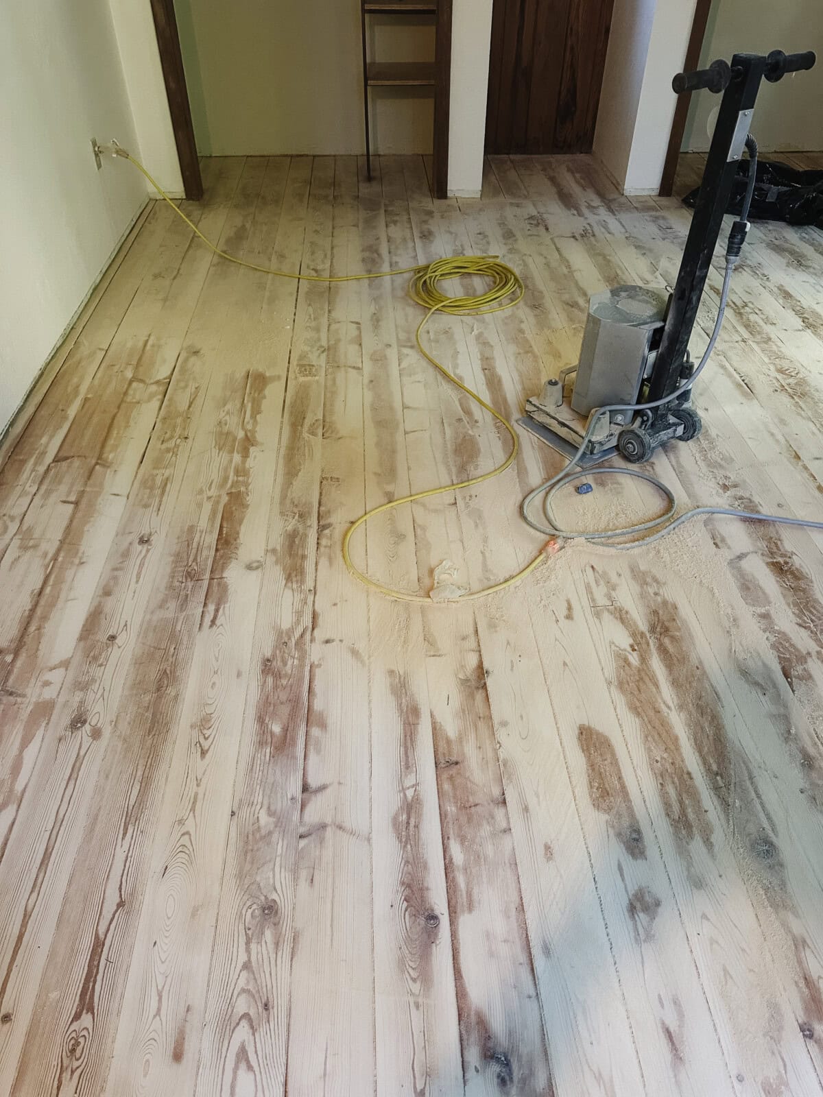 rough sanding in process with a belt sander floors looking not so good.