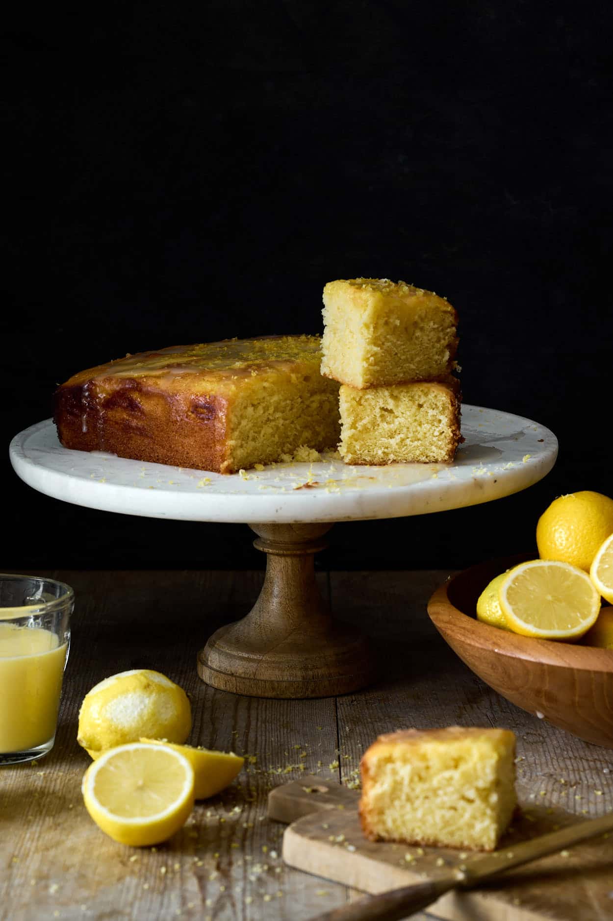 freshly served lemon curd cake with delicious drizzle and lemons. 