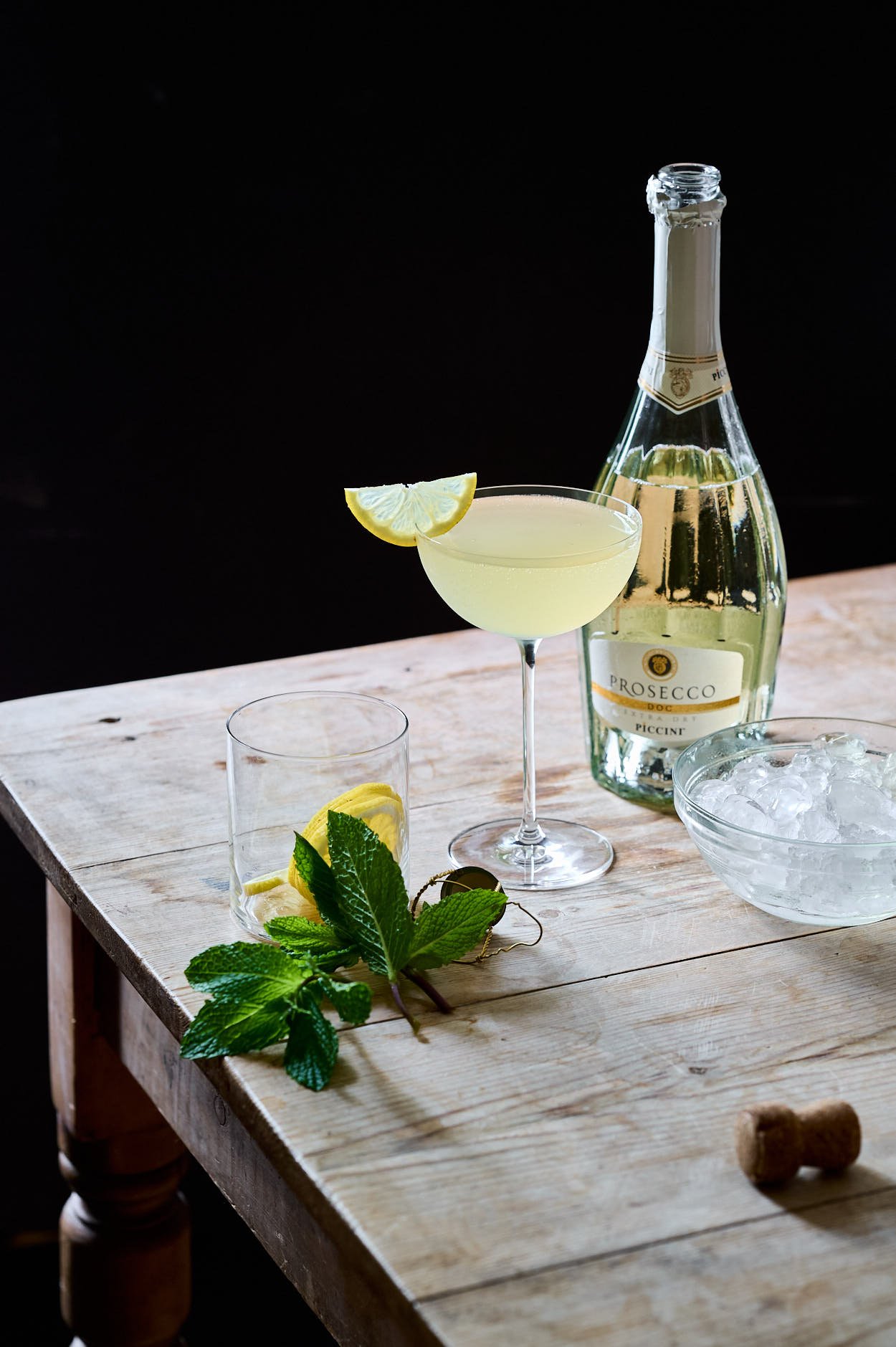 a freshly garnished Lemoncello cocktail with a lemon wedge. 