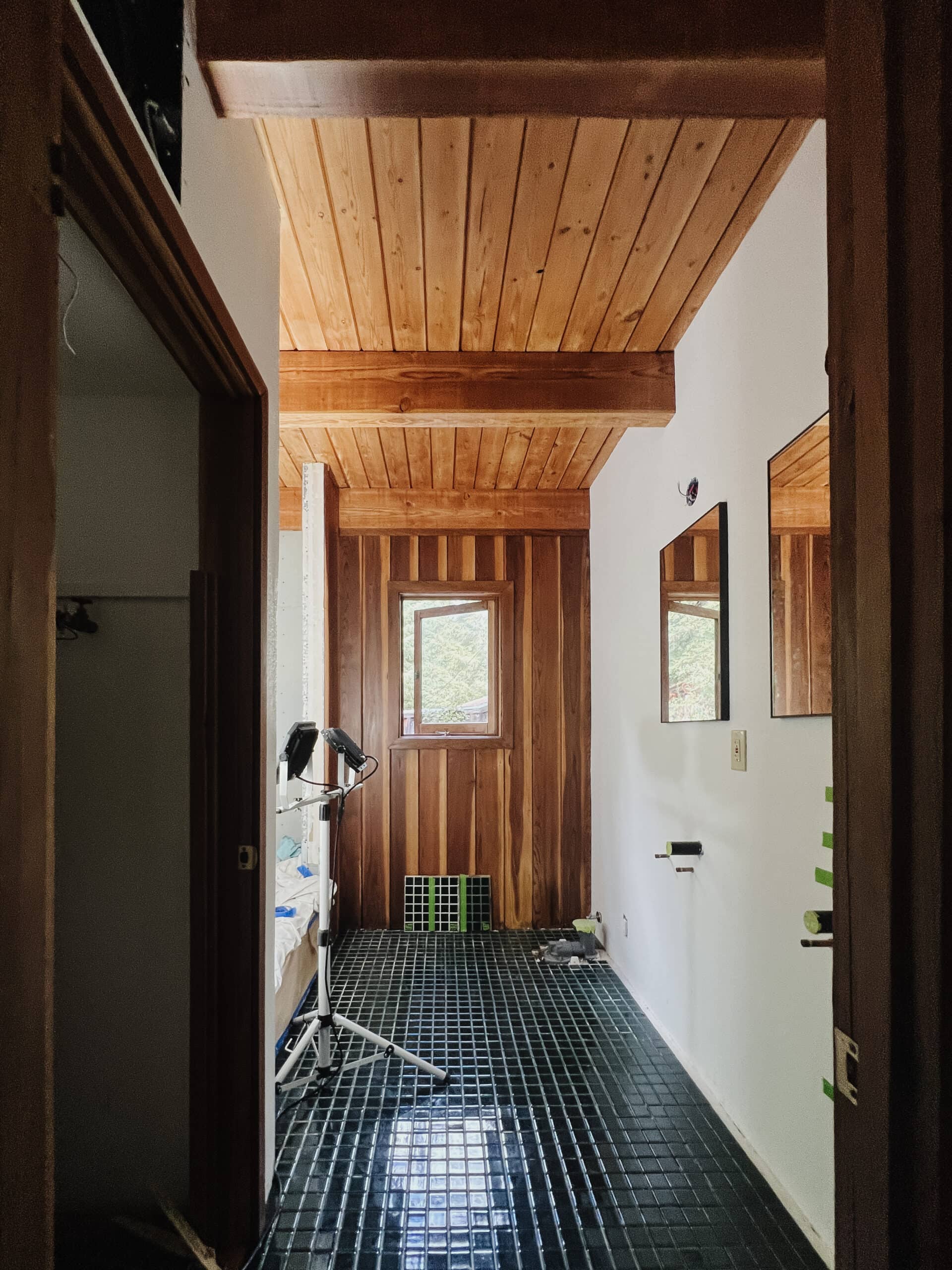Freshly installed heated flooring and tiles during the moody bath demo. 