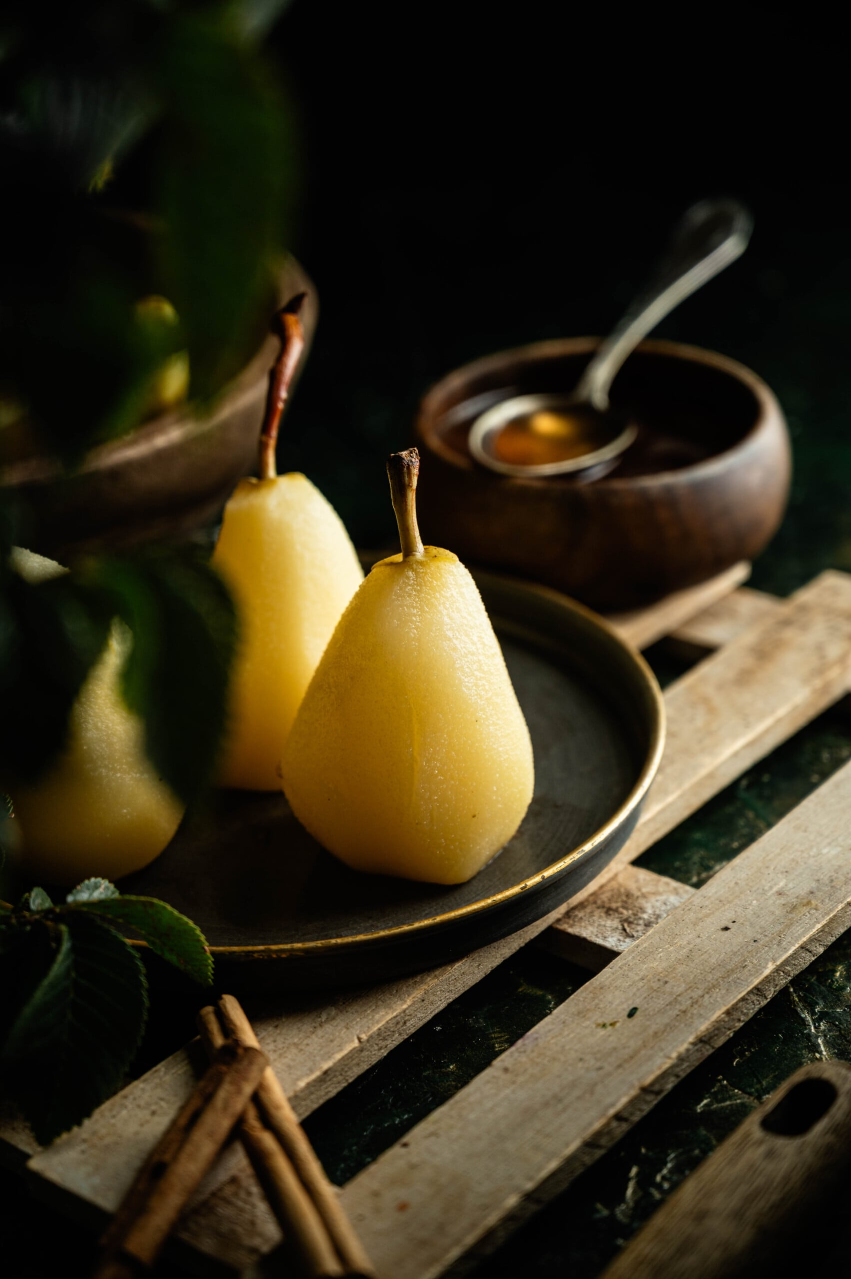 Simple poached pear dessert topped with homemade spiced syrup.