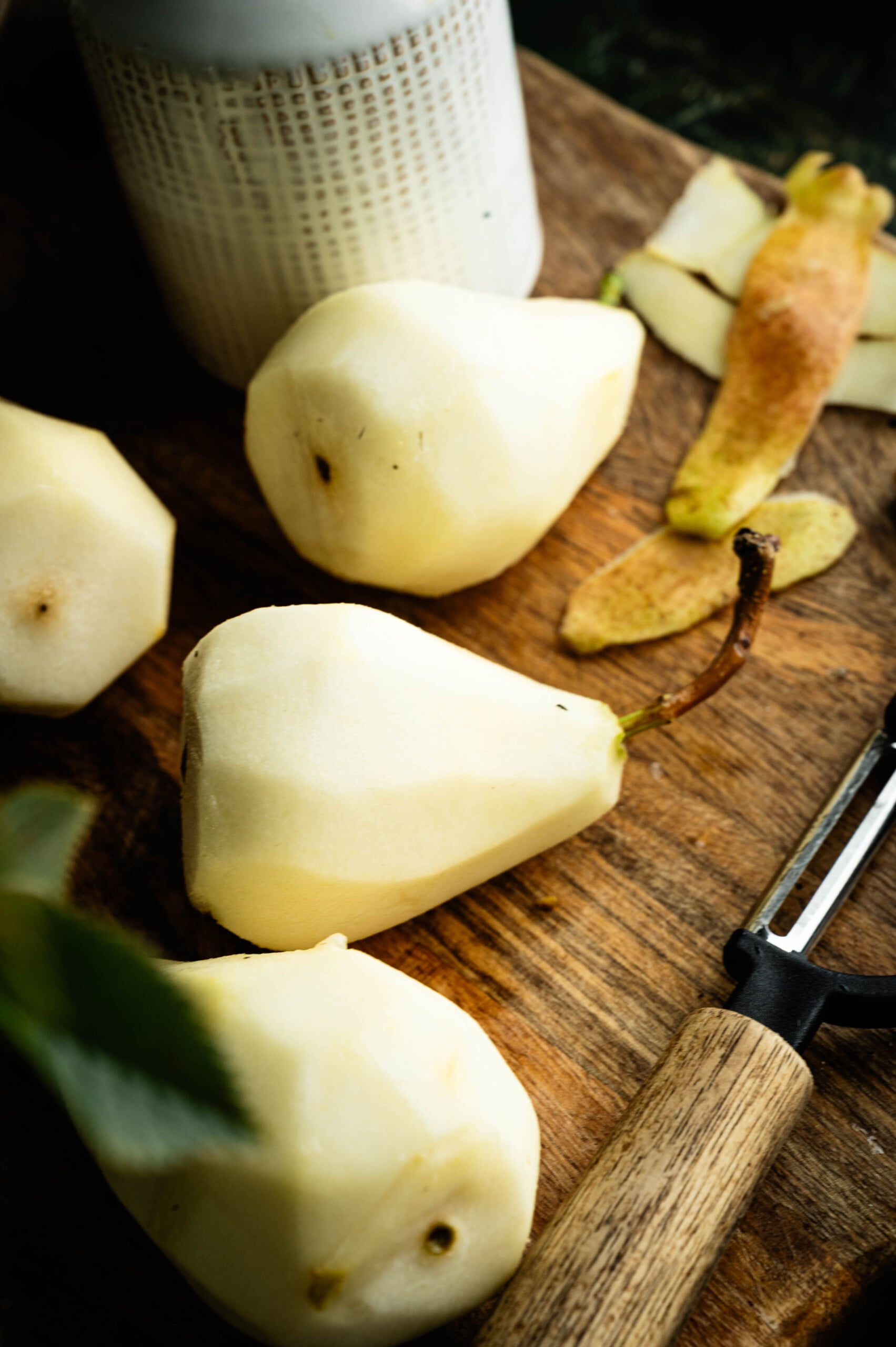 Firm Bosc pears peeled and used for a poached pears recipe.